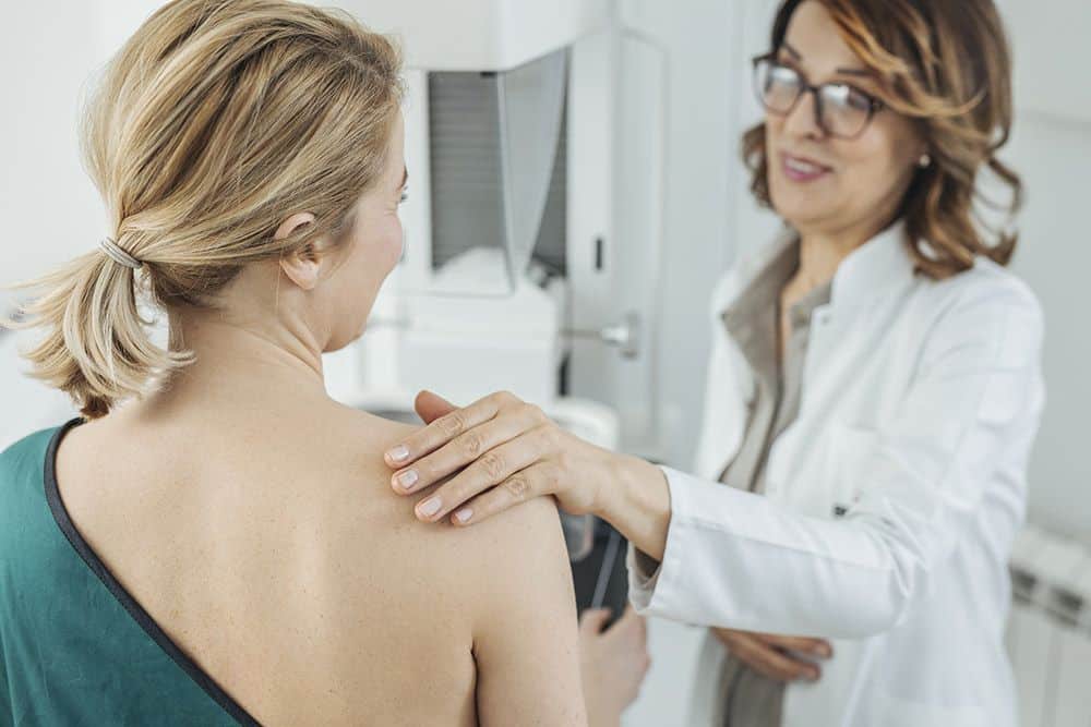 doctor and patient - women's imaging - breast exam results