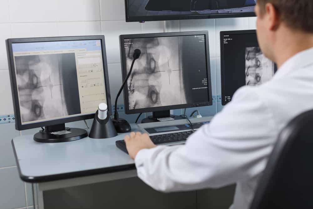 radiologist reviewing patient imaging results